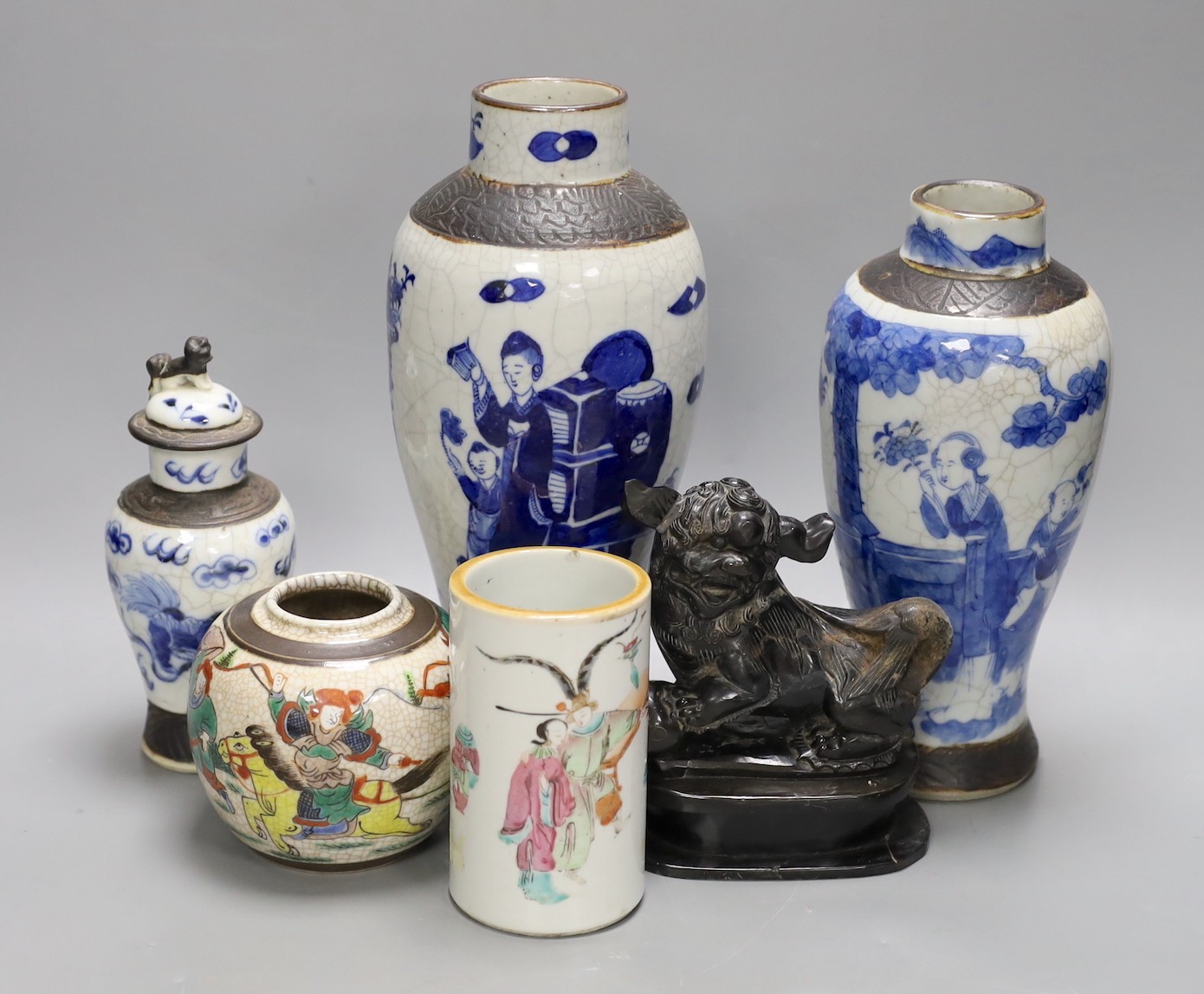 Three Chinese blue and white crackle glaze vases, a famille rose brush pot, late 19th/early 20th century, a crackle glaze ginger jar and a carved soapstone lion-dog (6)